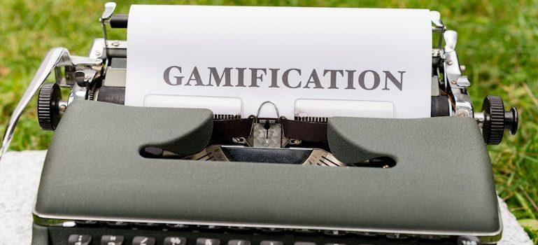 a typewriter with a sheet of paper saying gamification